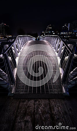 Small pedestrian bridge at night in False Creek, Vancouver. Editorial Stock Photo