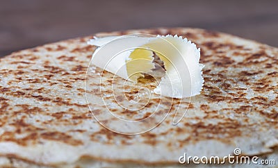 Small piece of butter on stack of Russian pancakes Stock Photo