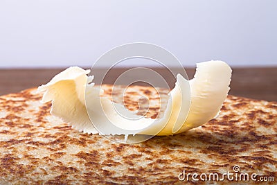 Small piece of butter on stack of Russian pancakes - blini Stock Photo