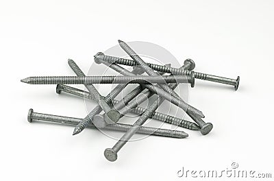 A small pile of galvanized, zinc plated sixteen penny nails Stock Photo