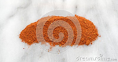 Small pile of taco seasoning on a marble cutting board Stock Photo