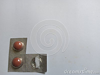 small pills with big efficacy on a plain white background Stock Photo