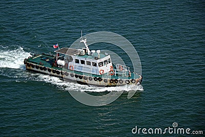 Small Pilot Boat Returns to the Harbor Editorial Stock Photo