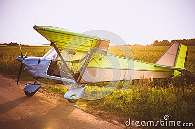 Small plane in the sky and on the field Editorial Stock Photo