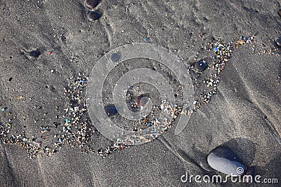 Microplastics on a beach. Famara Beach, Lanzarote Stock Photo