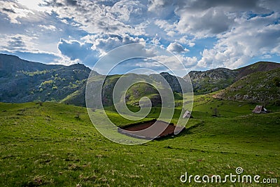 A small plowed field on a farm. Beautiful old mountain village Stock Photo