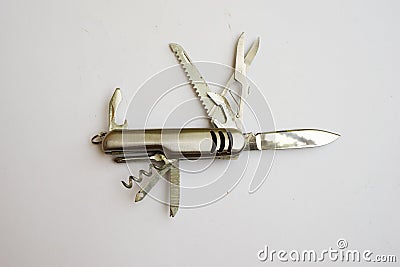 Small pocket penknife of stainless steel on a white background. Modern folding knife Stock Photo