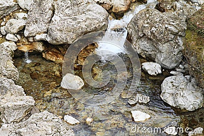 Small pond with stones in river Stock Photo