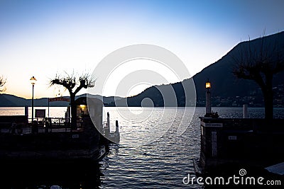 Small port of a town on Lake Como with storage of fishing boats Stock Photo