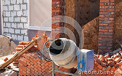 small portable concrete mixer at construction site Stock Photo