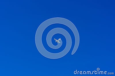 Small private airplaine on a blue sky. Stock Photo