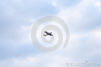 Small private flying airplane yet flying in the sky with cloudy weather Stock Photo