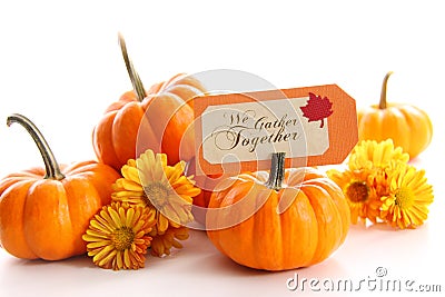 Small pumpkins with chrysanthemums and card Stock Photo