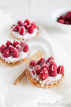 Small raspberry tartlettes Stock Photo