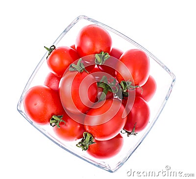 Small red cocktail tomatoes in glass bowl Stock Photo