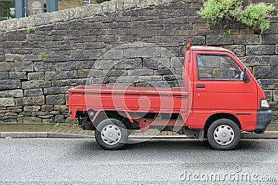 Red small open back van pickup Editorial Stock Photo