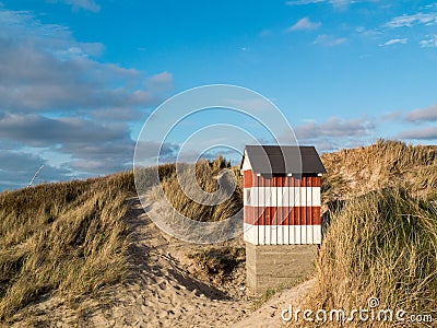 Small red and white striped hut Stock Photo