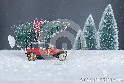 Small retro car with Christmas tree Stock Photo