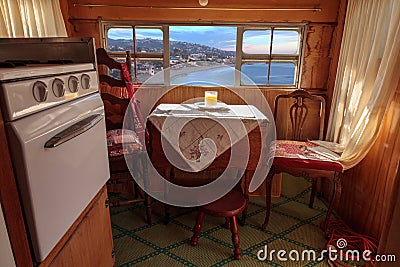 Small retro caravan camper used as a tiny house on road trips Stock Photo