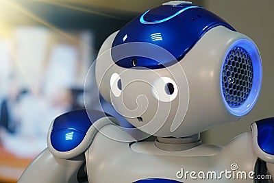 A small robot with a human face and a humanoid body. Artificial intelligence - AI. Blue-and-white robot. Editorial Stock Photo