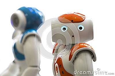 Small robots with human face and body. AI Stock Photo