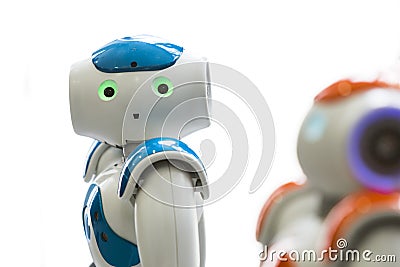 Small robots with human face and body. AI Editorial Stock Photo