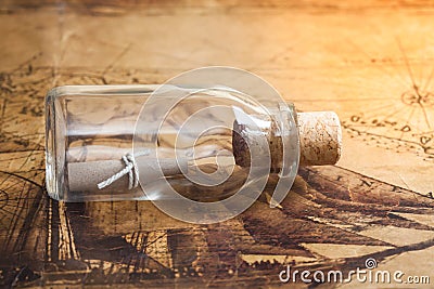 Small rolled message in a bottle Stock Photo