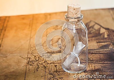 Small rolled message in a bottle Stock Photo