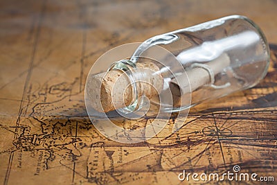 Small rolled message in a bottle Stock Photo