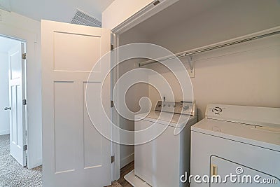 Small room inside a residential house with washing machine and dryer appliances Stock Photo