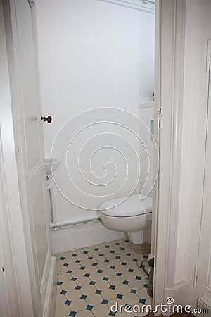 small room under the stairs hides the toilet wc Stock Photo