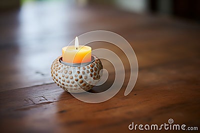 small round candle holder with a burning tealight Stock Photo