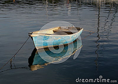 Small rowing boat on calm water Stock Photo