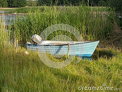 A small rowing boat next to the shore in Karlskrona Editorial Stock Photo