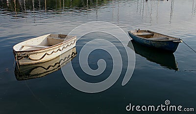 Small rowing boats on calm water Stock Photo