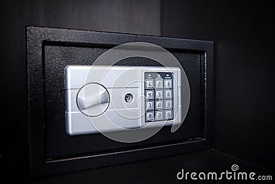 Small safe on shelf in your home or hotel Stock Photo