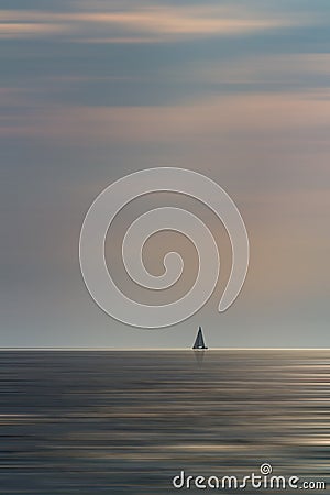 Small sailboat float on Croatia sea with cloudy sky. Long exposure, motion blur, minimalism photo Stock Photo