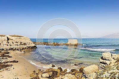 Small sandy beach on a sunny day. Stock Photo