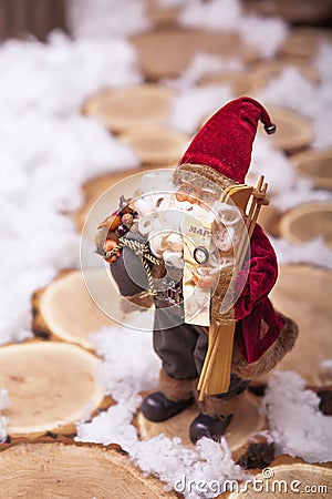 Small Santa standing on stumps track Stock Photo