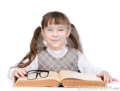 Small schoolgirl with big book. isolated on white background Stock Photo