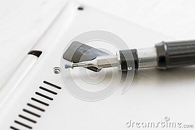 Small screwdriver with and a hole at a technical de Stock Photo