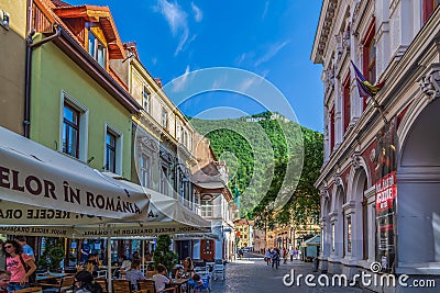 Small shops and terraces, Brasov, Transylvania, Romania Editorial Stock Photo