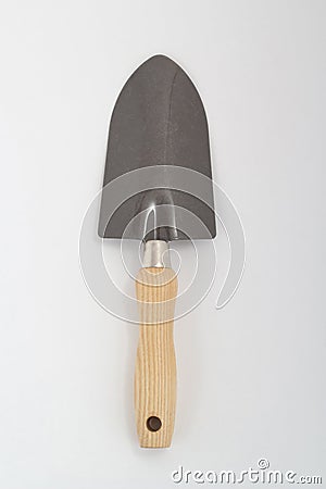 Small shovel with wooden handle, gardening tool isolated Stock Photo