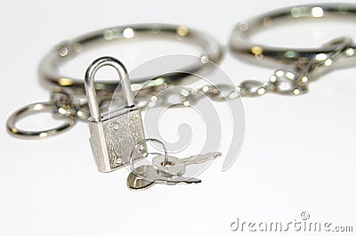 Small silver lock on handcuff background Stock Photo