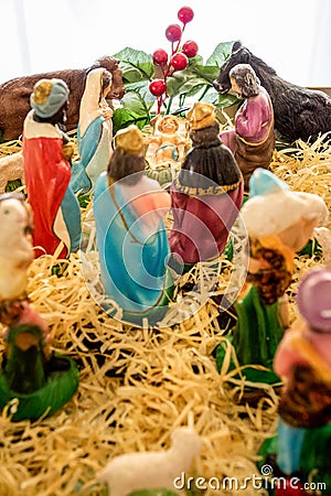 Small and simple Catholic crib made with plaster and straw Stock Photo