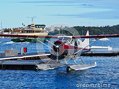 Docked Single Engine Seaplane and Sydney Harbour Ferry, Australia Editorial Stock Photo