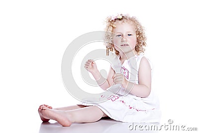 Small smiling baby in white dress Stock Photo