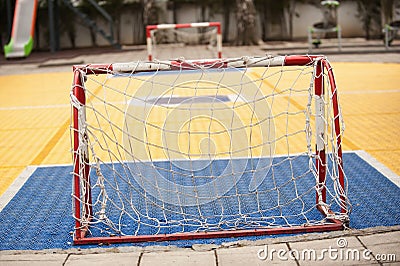 Small soccer field with football goal on children playground yard Stock Photo