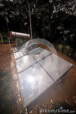 small solar heater with solar panels installed in rural areas of Brazil careless and precarious equipment Stock Photo