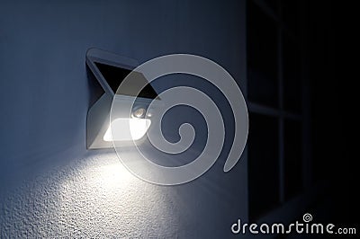 Small solar powered led light with motion sensor Stock Photo